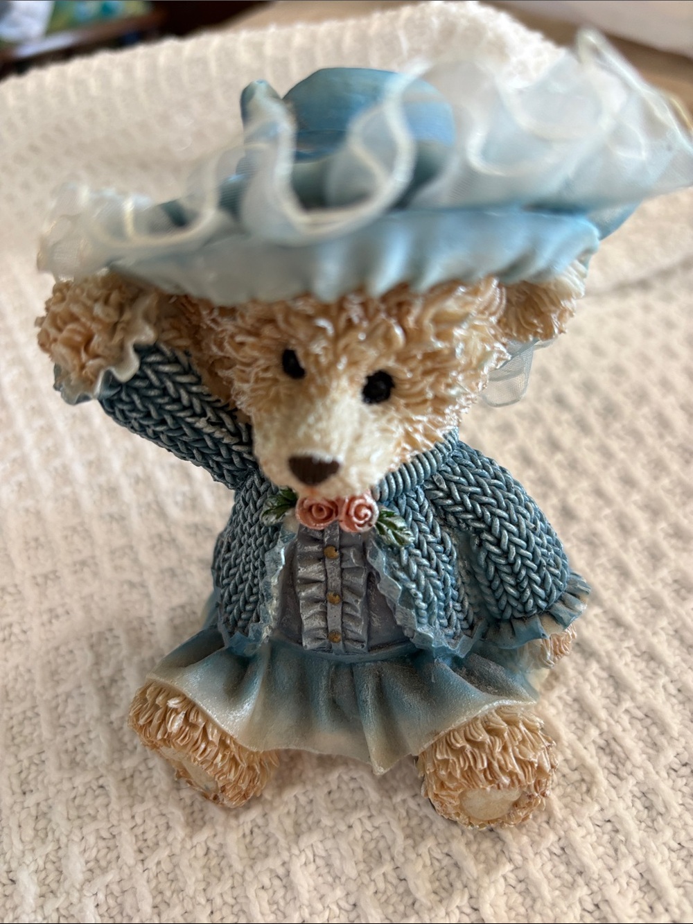 This is a vintage Greenbrier International collectible bear figurine